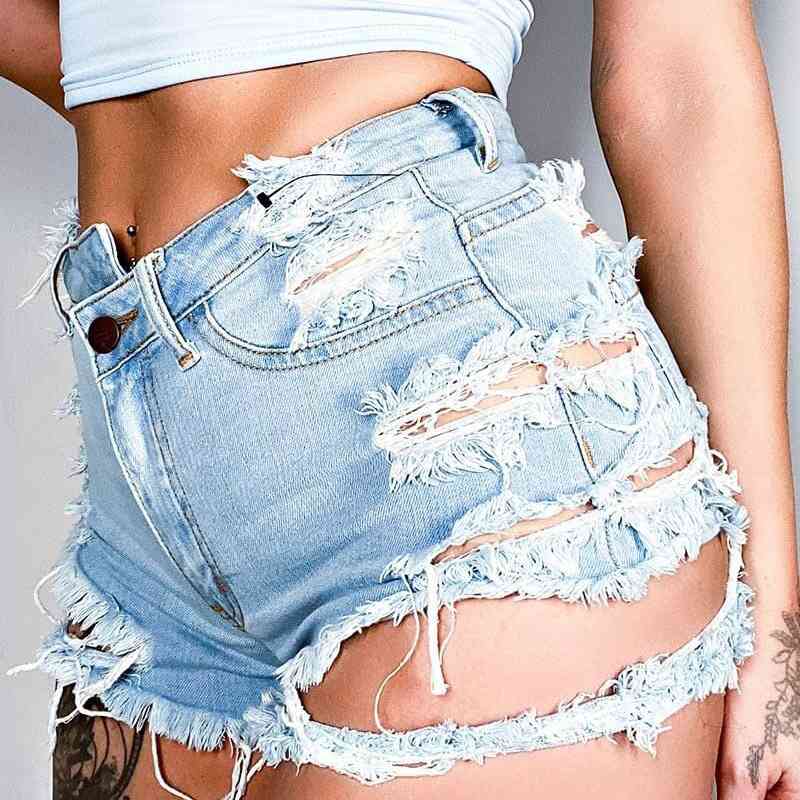 Side close-up of the Joyride Shorty Shorts, showing the mid-waisted rise and distressed denim texture.