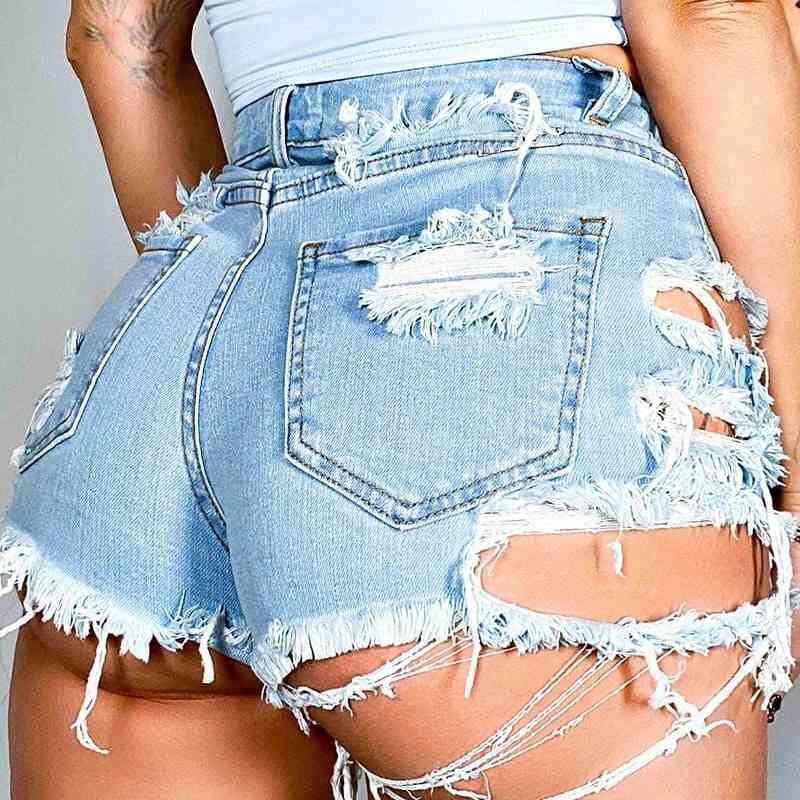 Back close-up of the Joyride Shorty Shorts, showing distressed denim texture and stretch fit through the seat.
